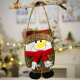 Snowman Gift Bag on a tree branch