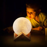 LED Moon Lamp kid staring